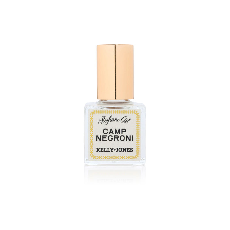 Camp Negroni Perfume Oil with gold cap on white background