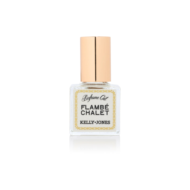 Flambe Chalet Perfume Oil with gold cap on a white backdrop