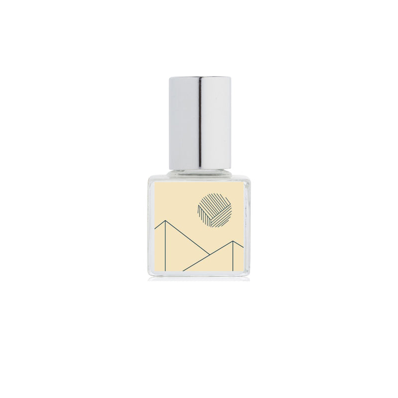 A bottle of Kelly + Jones Mezcal Blanca Perfume Oil Roll-On on a white background