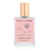 A bottle of Kelly + Jones Mezcal Flora Eau de Parfum Spray with a pink label and a gold cap.