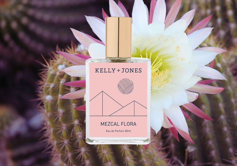 A bottle of Kelly + Jones Mezcal Flora Eau de Parfum Spray with a cactus in bloom