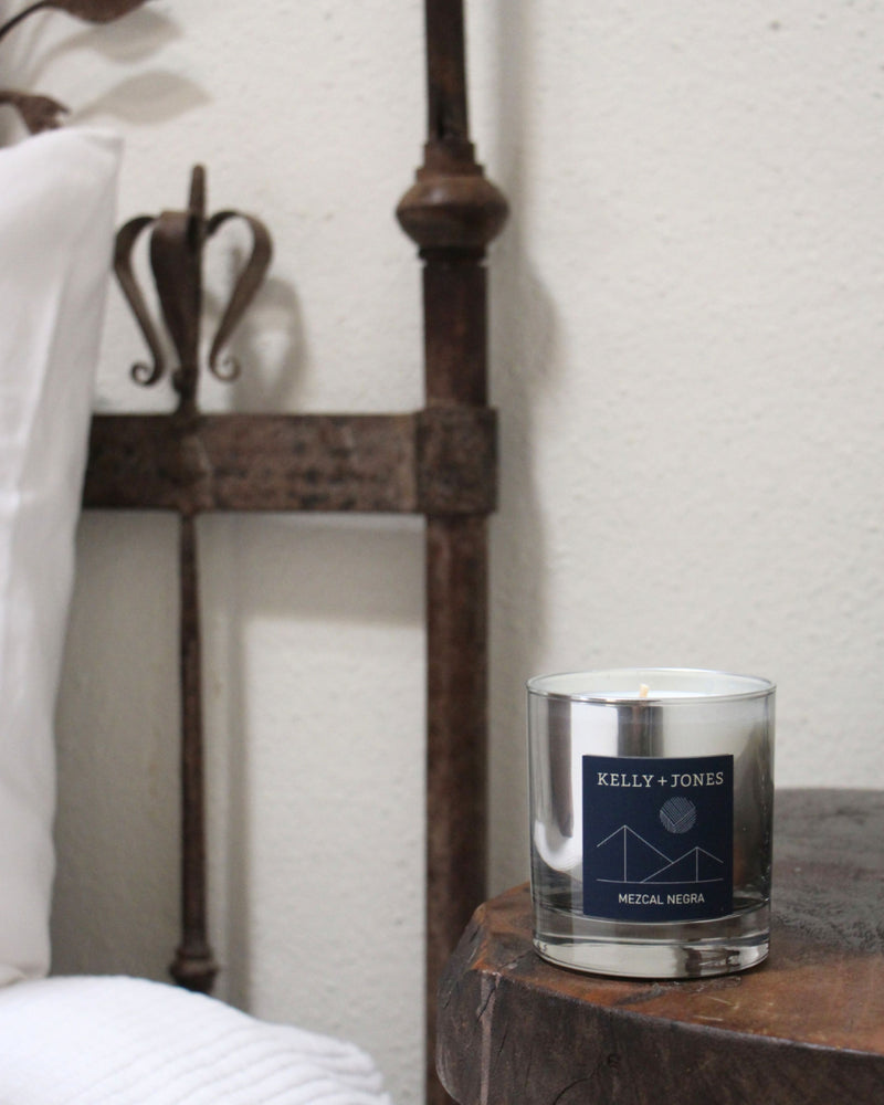 Mezcal Negra scented candle in a vintage bedroom in Oaxaca.