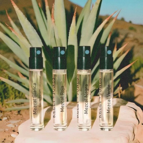 K+J Eau de Mezcal Sample Flight, 3 vials against an agave desert background.