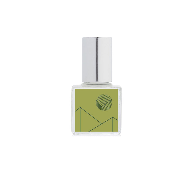 A bottle of Kelly + Jones Mezcal Verde Perfume Oil on a white background