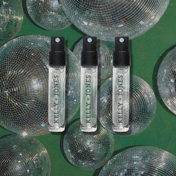 K+J Supper Club Sample Flight, 3 vials against a disco ball glittering with green background